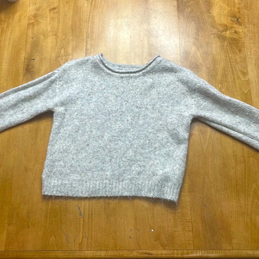 A fluffy sweater from copper key, gray with specs of gold